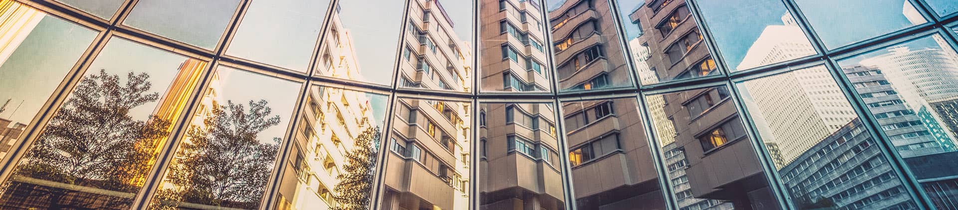 city reflection in windows